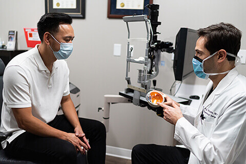 Eye Doctor and patient wearing masks