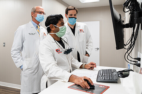 Retina specialists looking at computer